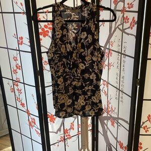 Black white and gray floral sleeveless shirt.